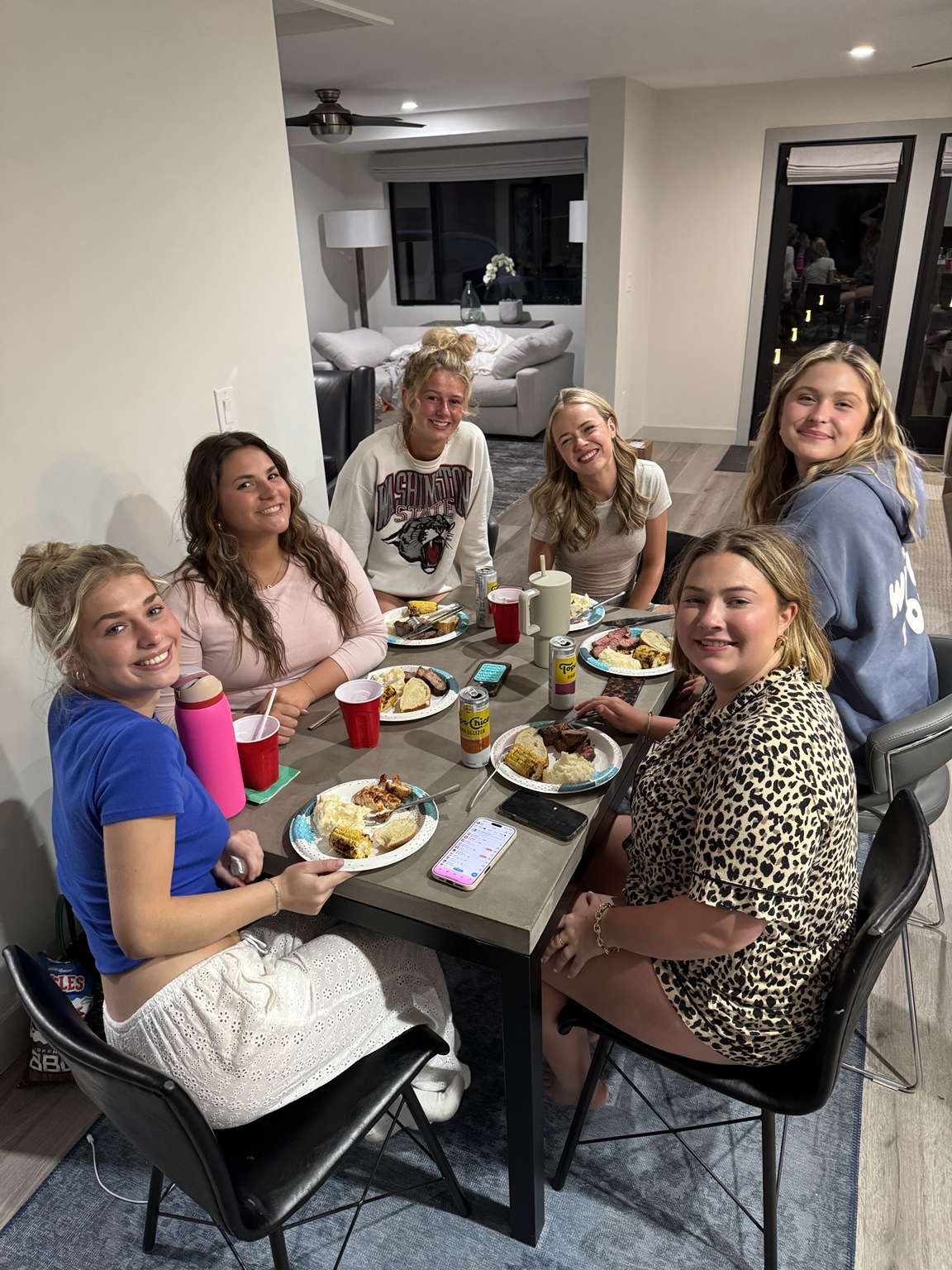 College friends sharing a home-cooked dinner