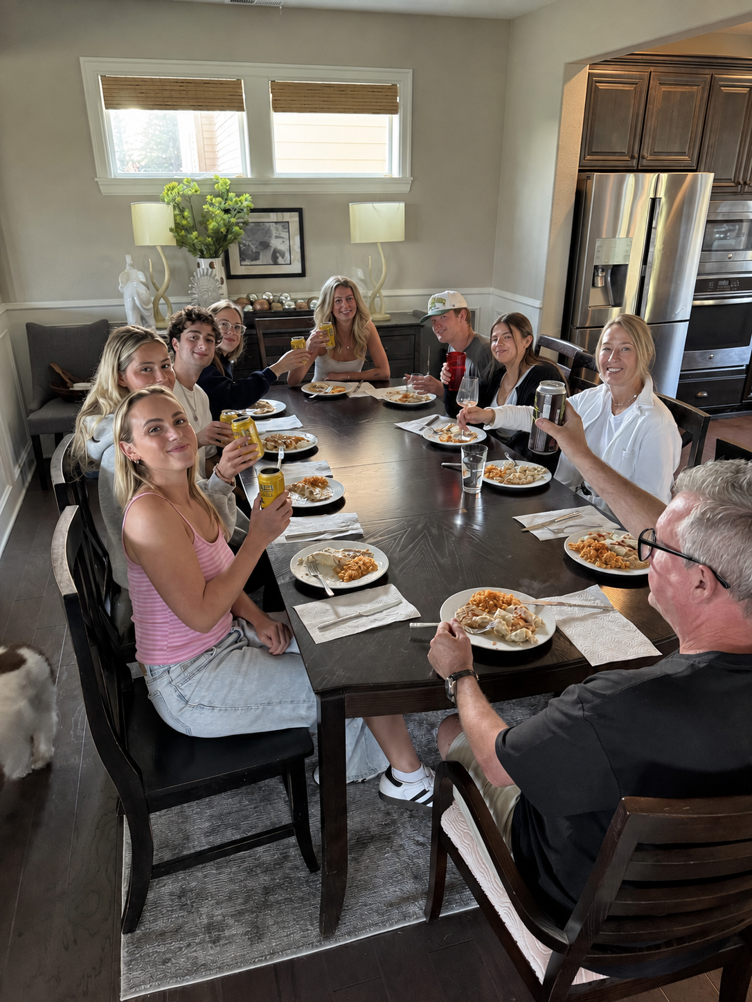 Family and friends gathered around Kami's dinner table