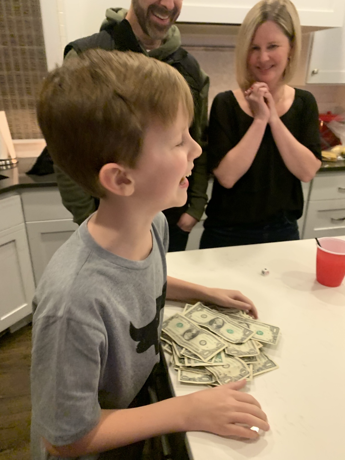 A young Left Right Center winner with the prize money