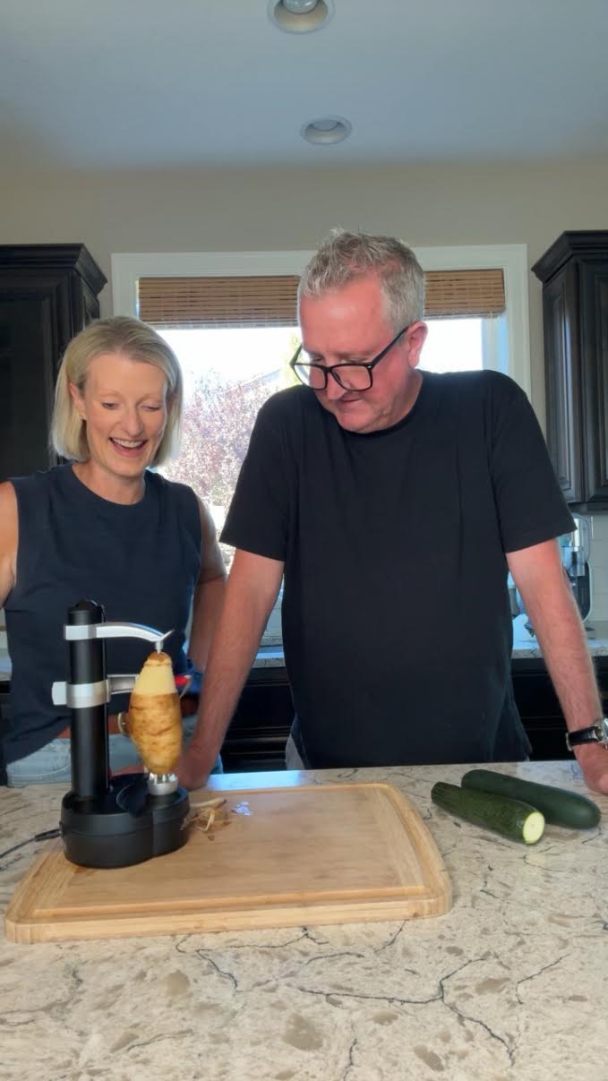 Kami and Sean using the Rotato Express electric peeler