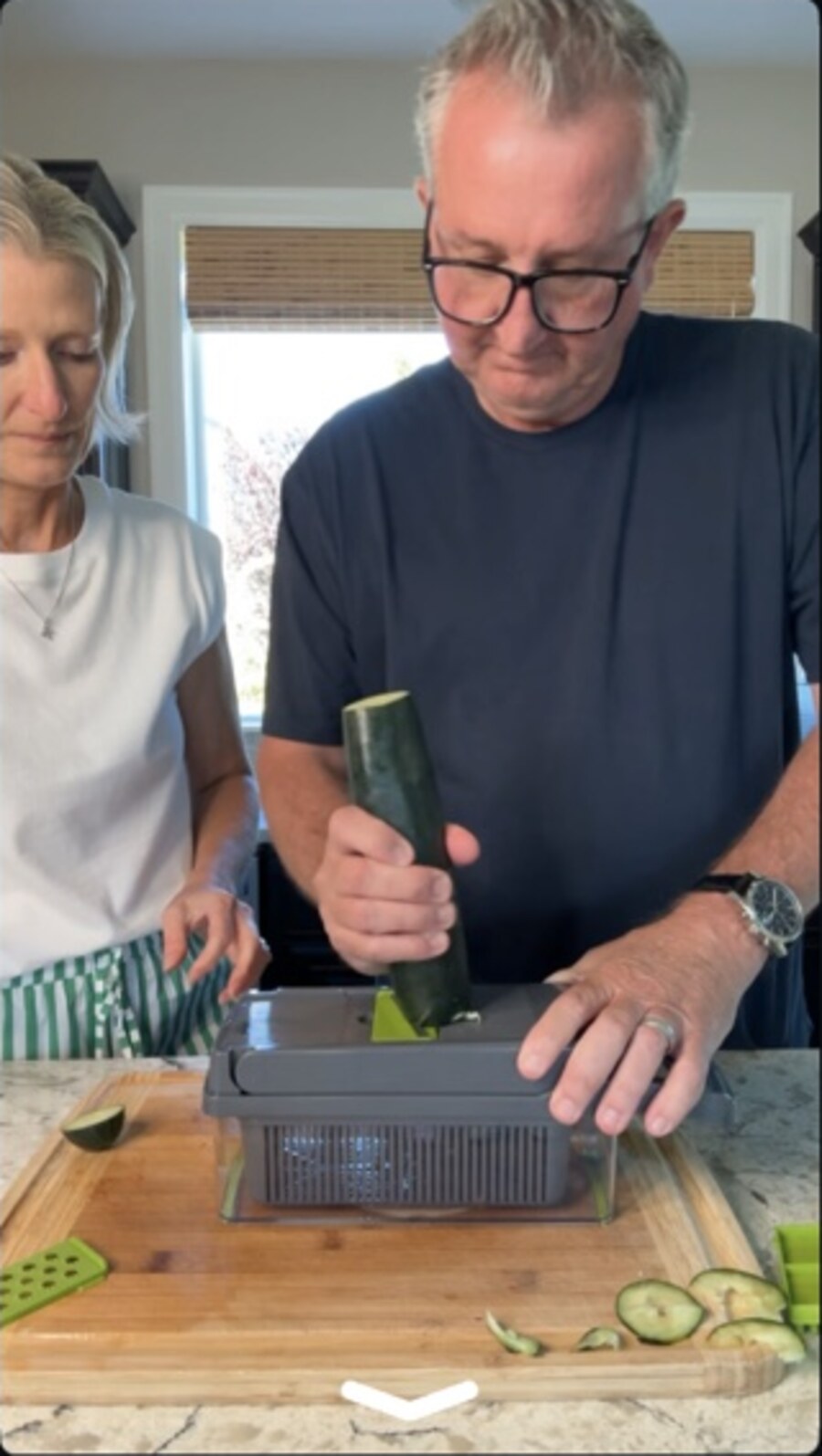 Sean using the gray vegetable chopper